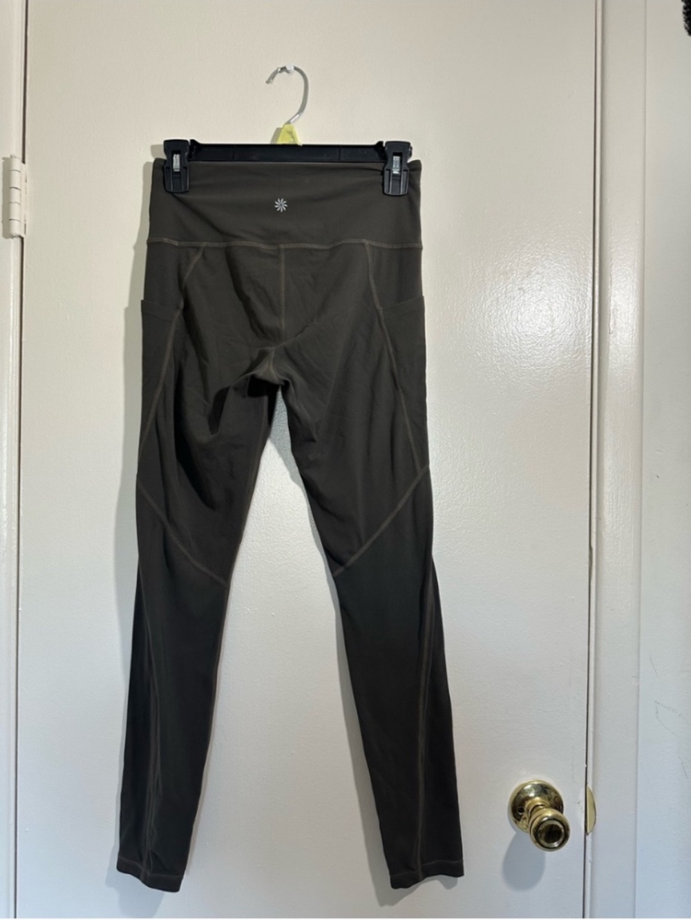 Dark Green Athleta leggings with side pockets